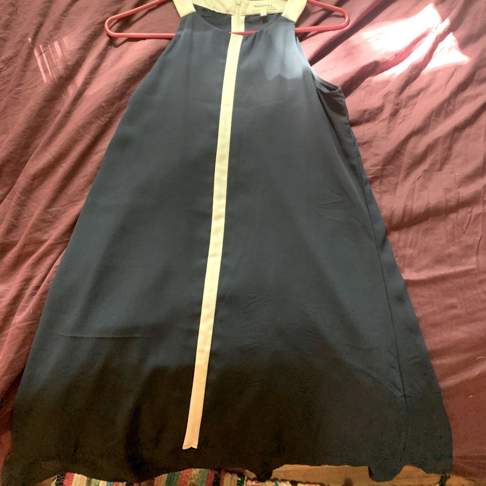 Size small navy dress with cream stripe down the middle. 100% polyester